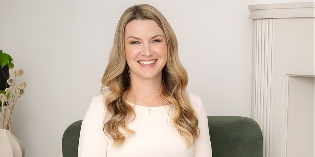 LisaMarie Gauthier smiling, embodying her soulful leadership philosophy in a serene, professional setting, promoting authentic success.