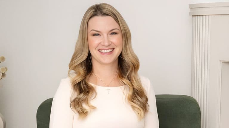 LisaMarie Gauthier smiling, embodying her soulful leadership philosophy in a serene, professional setting, promoting authentic success.