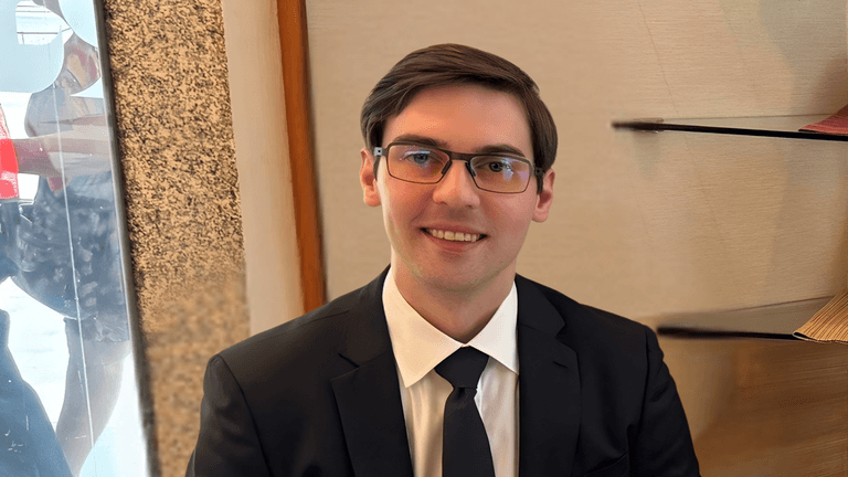 Eugene Prudchenko, CEO of Burakorn Partners, showcasing a professional appearance while leading Asia’s first AI operator division.