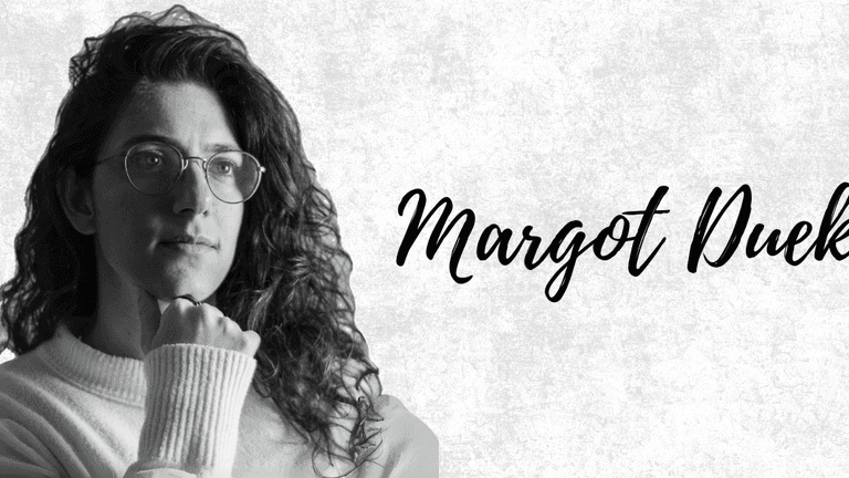 Black and white portrait of Margot Duek, showcasing a thoughtful expression and elegant, natural curls.