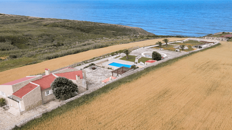 52 Atlantic Estate: A luxurious oceanfront property with expansive grounds, private pool, and serene views of the Atlantic Ocean.