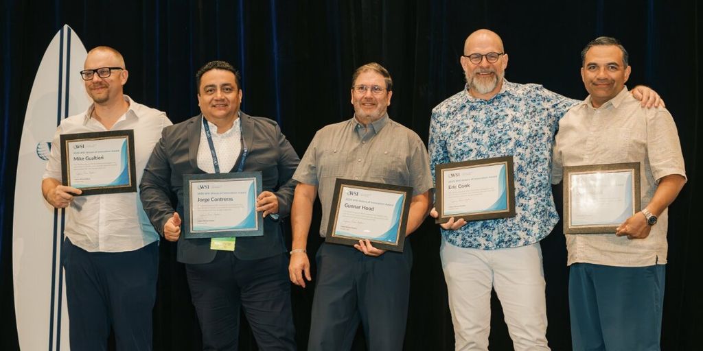 Jorge Contreras and fellow WSI consultants pose with innovation award certificates at the WSI Global Convention.
