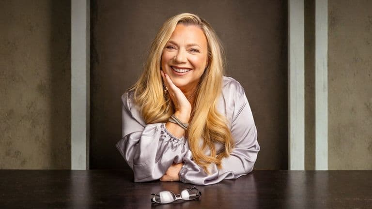 Clare Ford smiling confidently while seated, embodying empowerment and emotional intelligence for teens in her SwitchedON! program.