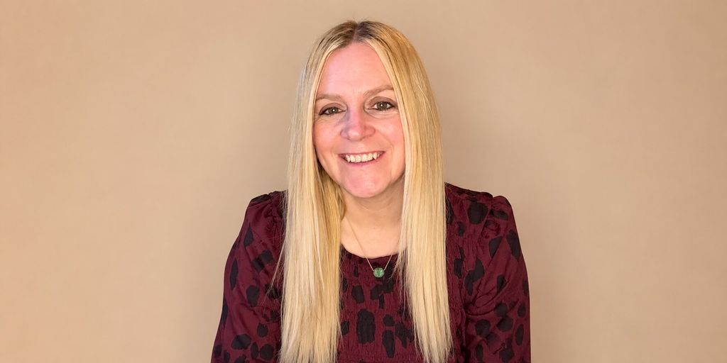 Portrait of Sarah Darracott Hawkins smiling, founder of We Love PMO, helping businesses scale through smarter operational systems.