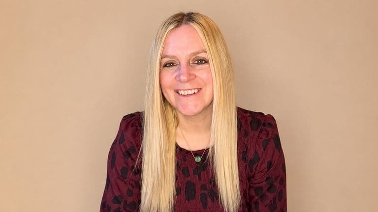 Portrait of Sarah Darracott Hawkins smiling, founder of We Love PMO, helping businesses scale through smarter operational systems.