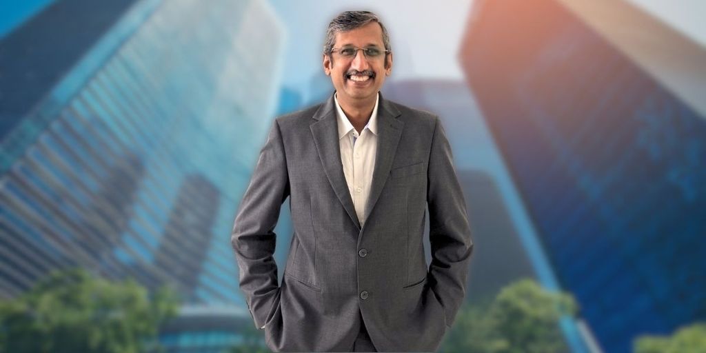Sagar Surana, an experienced financial leader, stands confidently in a professional setting, embodying expertise in global finance