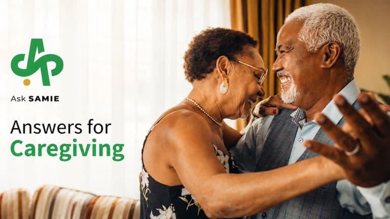 Older couple embracing beside AskSAMIE caregiving support branding.
