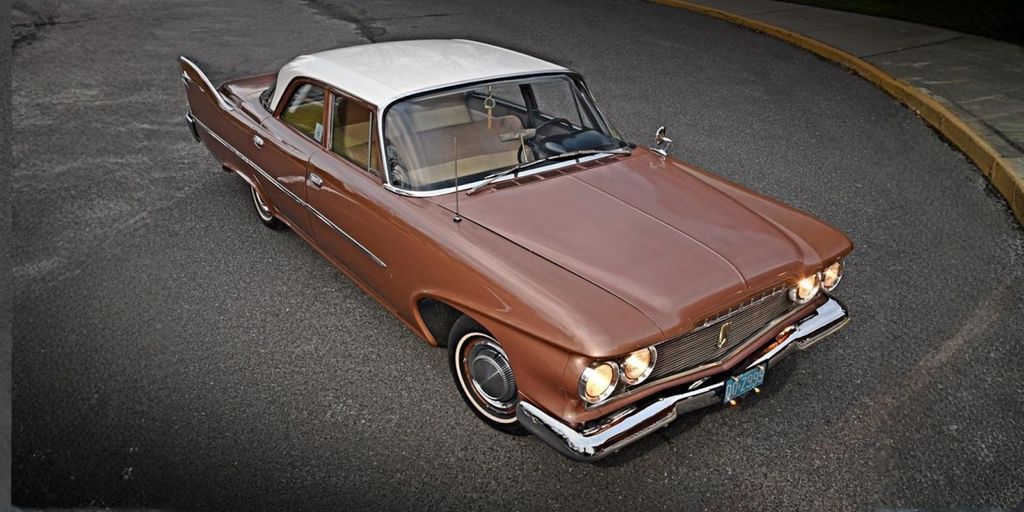 A classic 1960 Plymouth Savoy with a vintage two-tone design, capturing the essence of American automotive history and style.
