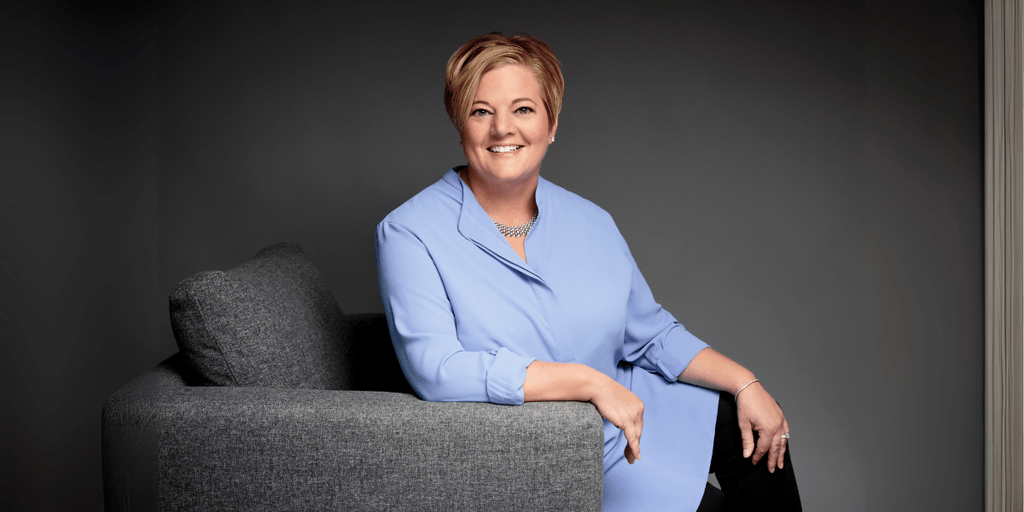Renee Hahn seated and smiling, representing her client-first approach to luxury real estate in Naples, Florida.
