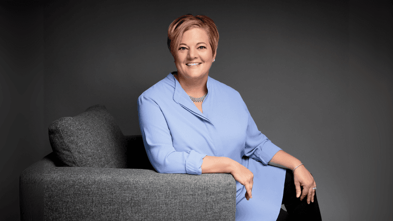 Renee Hahn seated and smiling, representing her client-first approach to luxury real estate in Naples, Florida.