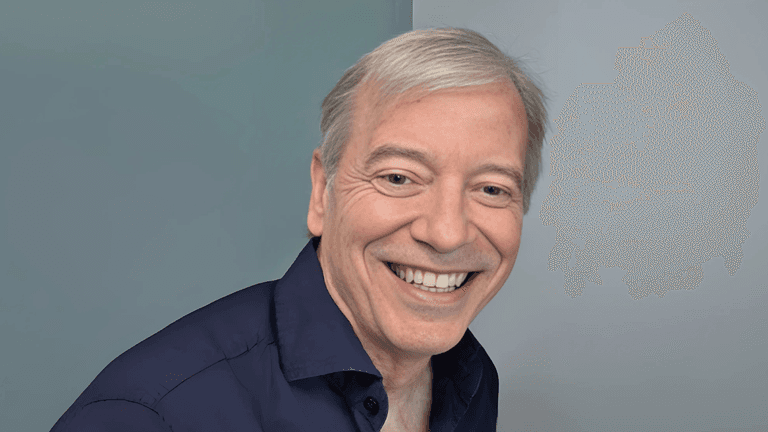 Eduardo M. Arroyo, founder of Arroyo & Associates, smiling confidently in a professional shirt, embodying leadership and innovation.