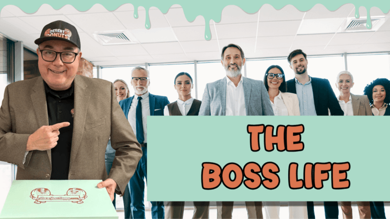 Michael Gallegos with a box of Desert Donuts, standing with colleagues in a professional office setting.