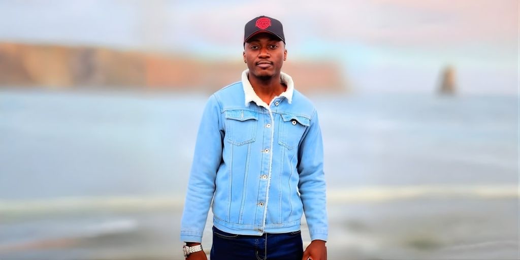 Jacob Sanni, UK-based cybersecurity leader and founder of Novidus Global, stands outdoors, reflecting innovation and resilience in technology.