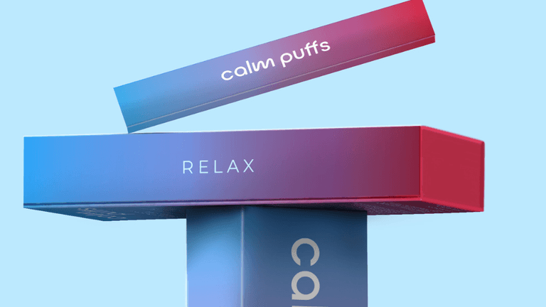 A gradient-colored packaging box for Calm Puffs, featuring the word 'RELAX' on the front, with another box floating above labeled 'calm puffs'. The background is a light blue gradient.