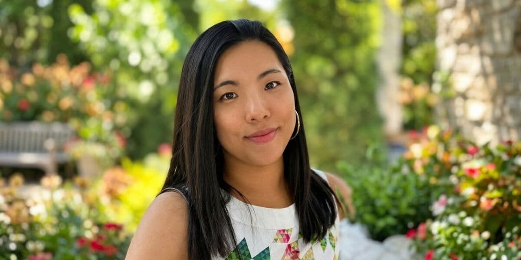 Portrait of HI Connect+ founder Zoe Lau Gungor outdoors in a garden setting.