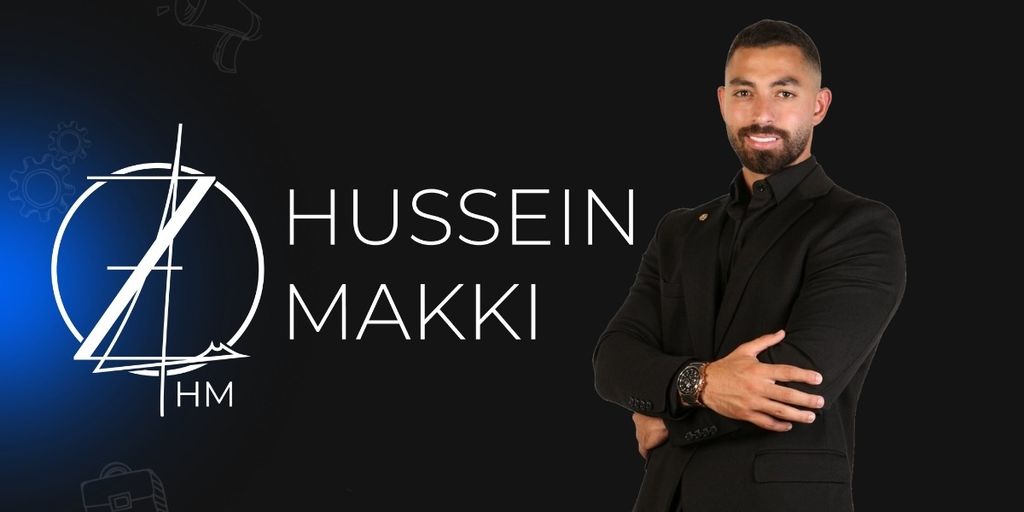 Hussein Makki in a professional pose with his logo, dressed in a black suit.