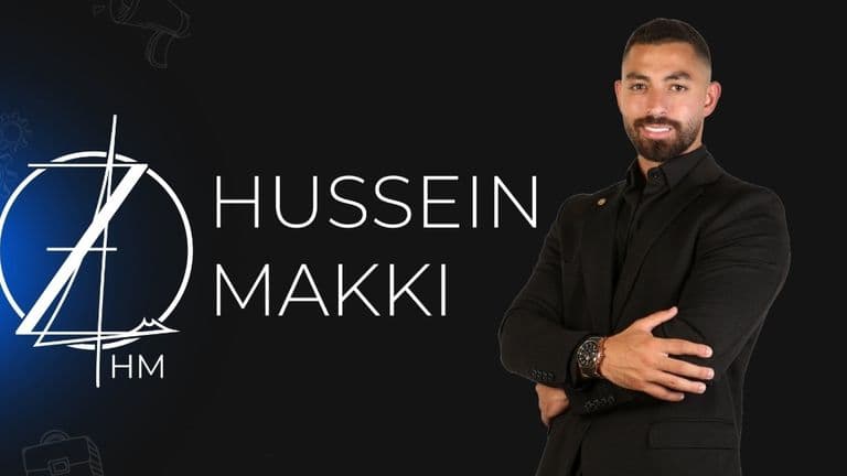 Hussein Makki in a professional pose with his logo, dressed in a black suit.