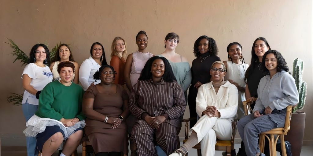 A diverse group of women from Boboto Doula Care, offering culturally sensitive postpartum support, gathered for a team photo.