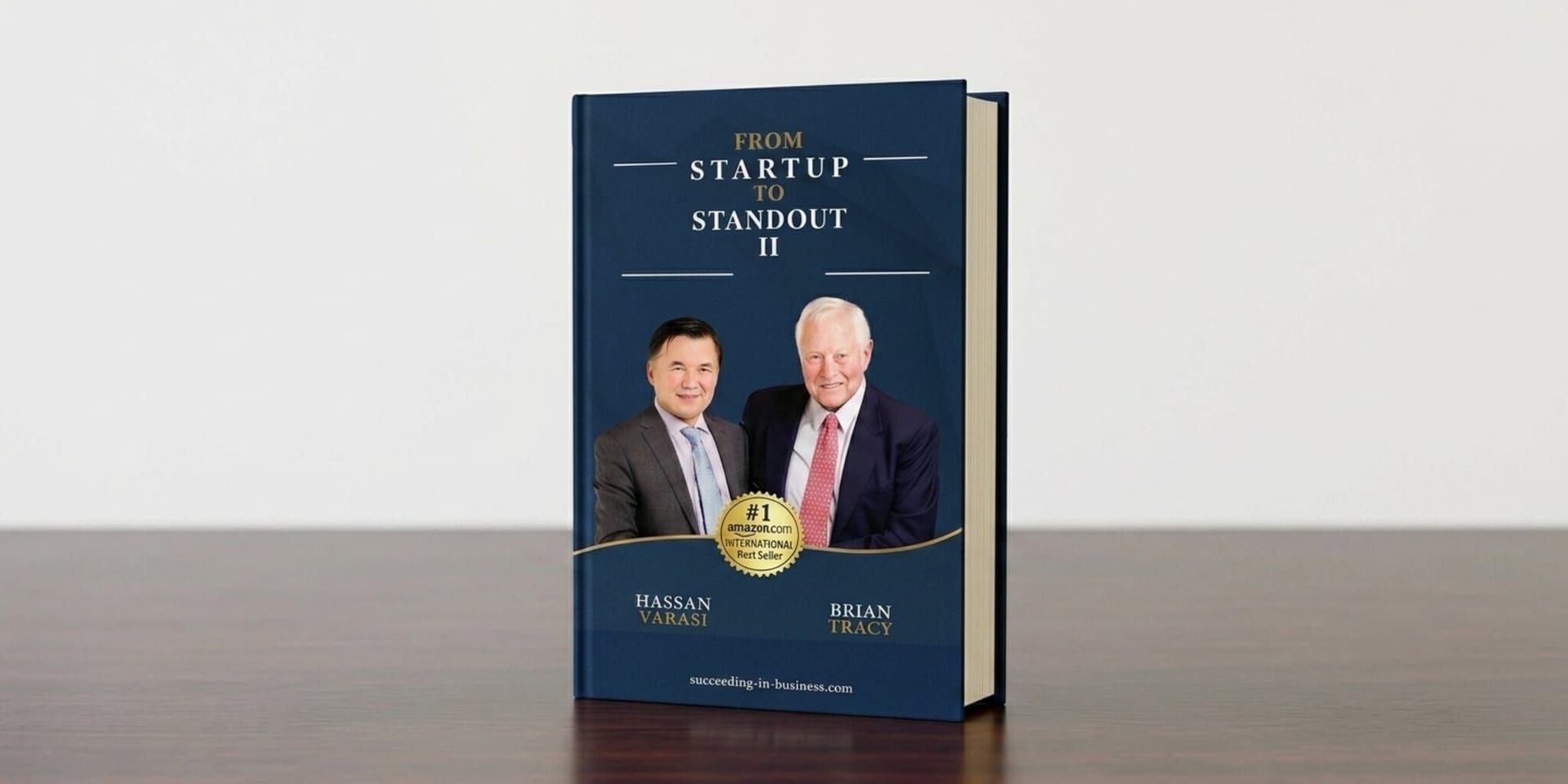 Book cover of “From Startup to Standout II” featuring Hassan Varasi and Brian Tracy on a blue background.