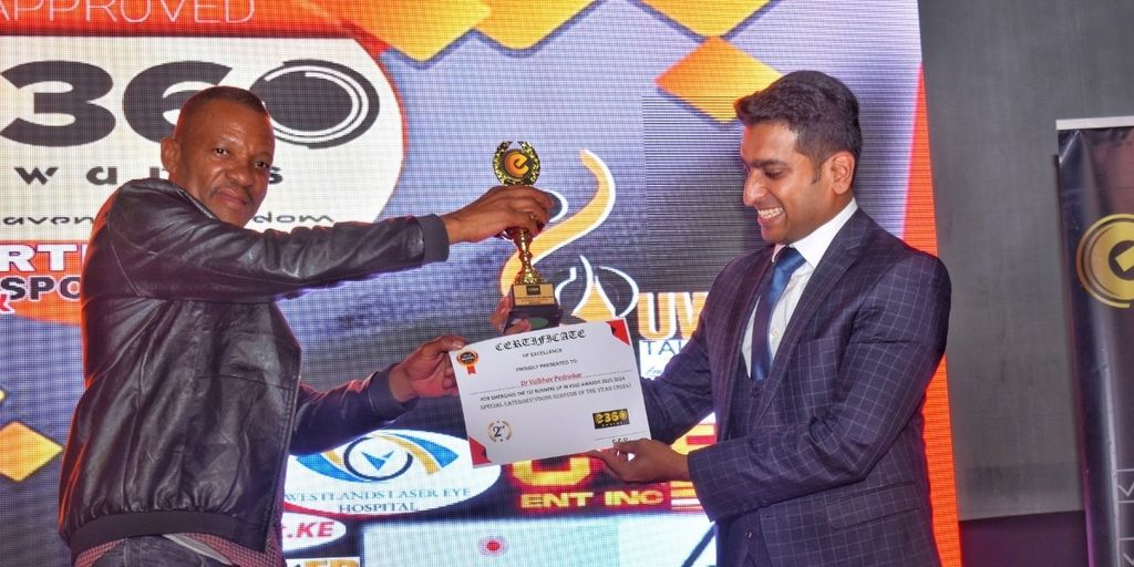 Dr. Vaibhav Pednekar receives an award for excellence in ophthalmology, recognized for his impactful work at Westlands Laser Eye Hospital.