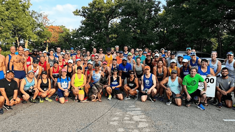A diverse group of runners from the Refresh Run Club in Madrid, united by wellness, performance, and community spirit.