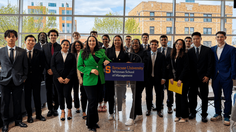 Marie Adornato speaking with Syracuse University Whitman School of Management students at a campus event.