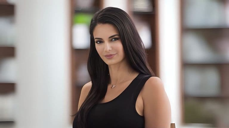 Setareh Motamedi wearing a black sleeveless top in a professional indoor portrait