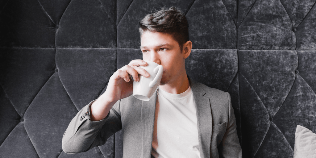 Carey James enjoying a coffee, embodying the essence of personal branding and human connection.