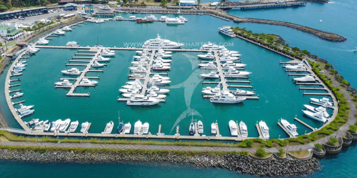 Aerial view of a marina filled with luxury yachts in Costa Rica.