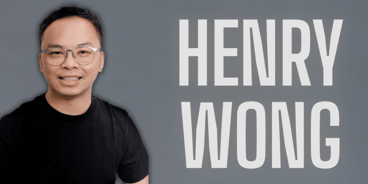 Professional headshot of Henry Wong wearing glasses and a black t-shirt, smiling against a gray background with bold white text displaying his name. Ideal for business branding, marketing, or personal website use