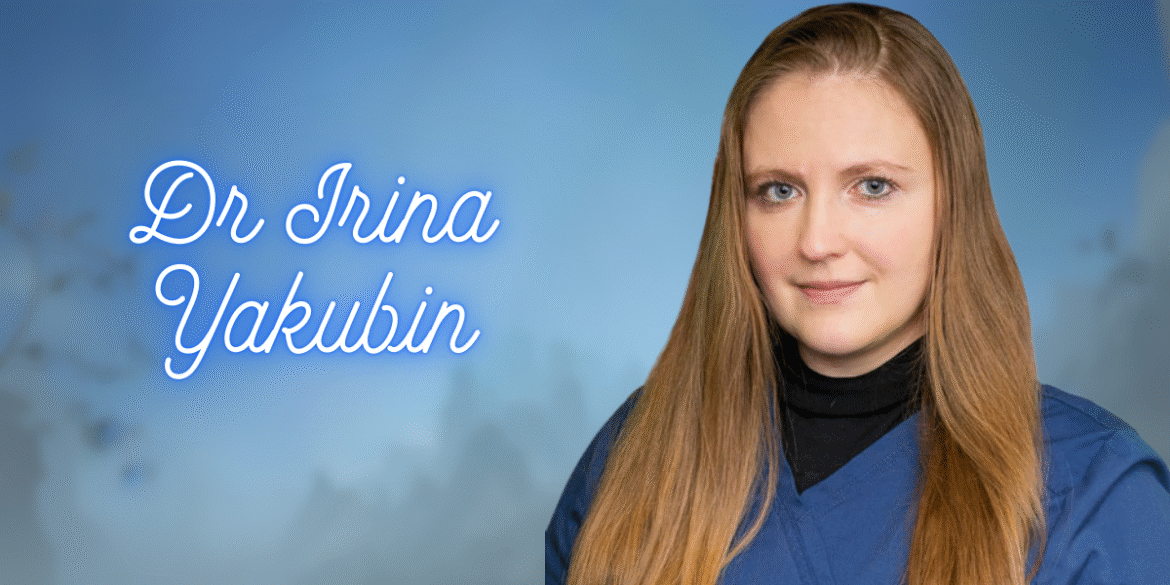 A portrait of Dr. Irina Yakubin, wearing medical scrubs, with a blurred blue background and her name written beside her.