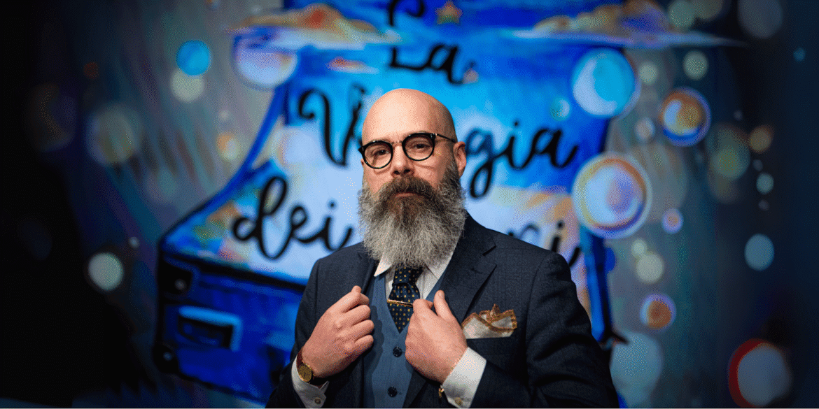 "Matteo Valléro, an esteemed Italian journalist and columnist, stands confidently in front of a colorful background, embodying the ethical values of 'Made in Italy' business culture."