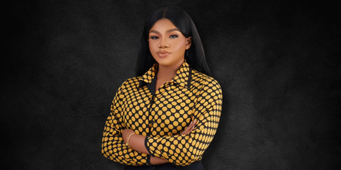"Portrait of a confident woman in a bold polka dot shirt, standing with arms crossed against a dark background, exuding strength and professionalism."
