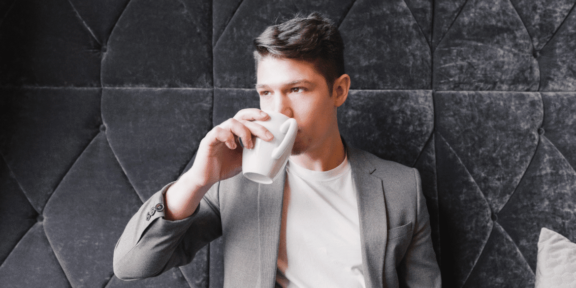 Carey James enjoying a coffee, embodying the essence of personal branding and human connection.