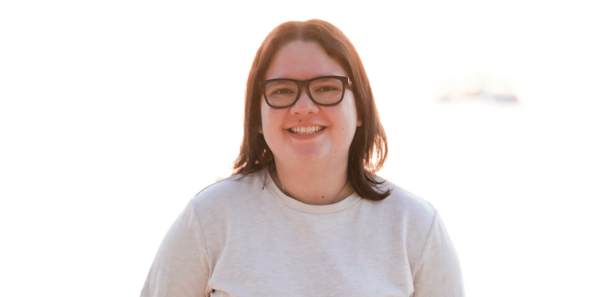 Krystal Blackwell, founder of Krystal Designs Marketing, smiling confidently, represents her agency's innovative EnquiryOS™ system for law firm marketing.