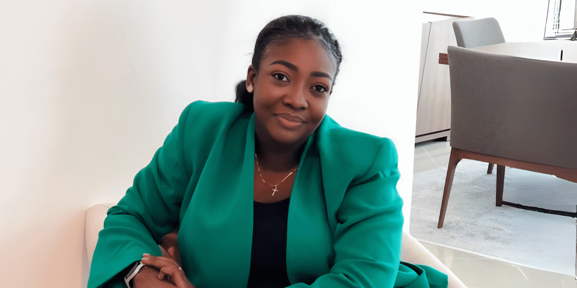 Dr. Osigbodi Ajose, CEO of Levitikal Consulting, smiles confidently in a professional setting, embodying her role as a visionary leader empowering young women to take on leadership positions and drive societal change.