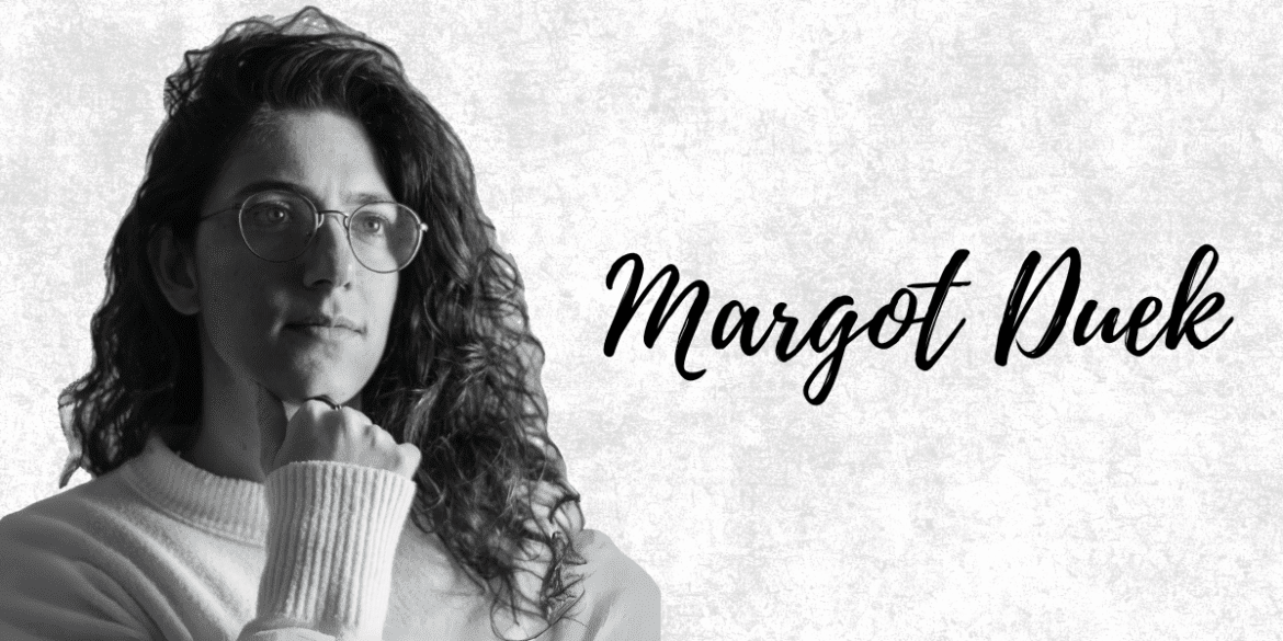 Black and white portrait of Margot Duek, showcasing a thoughtful expression and elegant, natural curls.