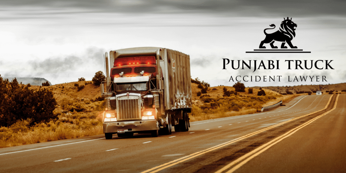 Truck driving on a highway with Punjabi Truck Accident Lawyer logo, symbolizing advocacy for justice in truck accident cases.