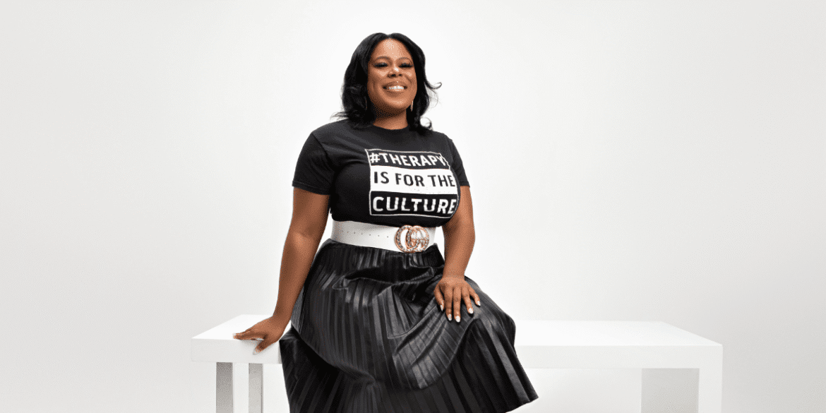 Dr. Adrienne White, founder of Dr. White Therapy Group, confidently promoting therapy for high-achievers and burnout recovery.