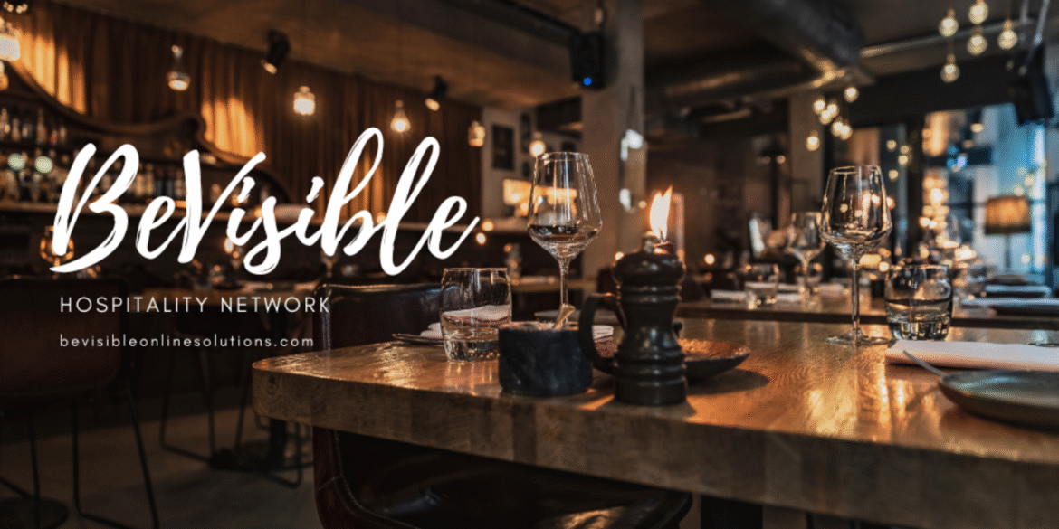 Elegant restaurant setting with candles and wine glasses, reflecting the warmth and hospitality of BeVisible Online Solutions.
