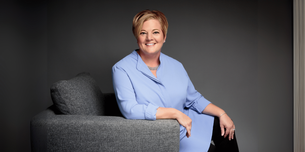 Renee Hahn seated and smiling, representing her client-first approach to luxury real estate in Naples, Florida.