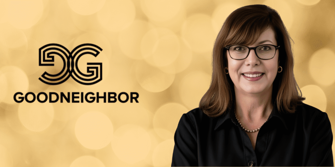 Portrait of a woman with glasses and a black blouse, smiling next to the "GoodNeighbor" logo against a golden bokeh background.