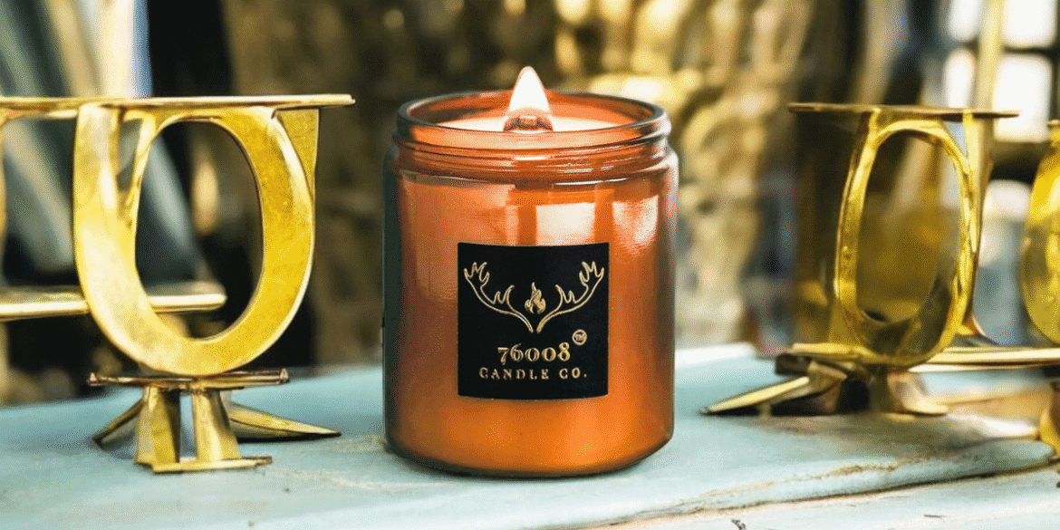 A leather-scented candle from 76008 Candle Co., highlighting the brand's focus on authenticity, craftsmanship, and family legacy.