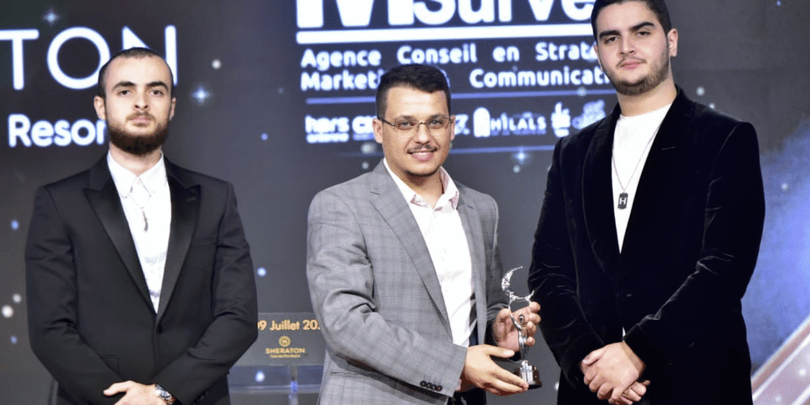 Seif Sid Ali Maloufi and team receiving an award, highlighting Ascend Studios' success in AI automation and business transformation.