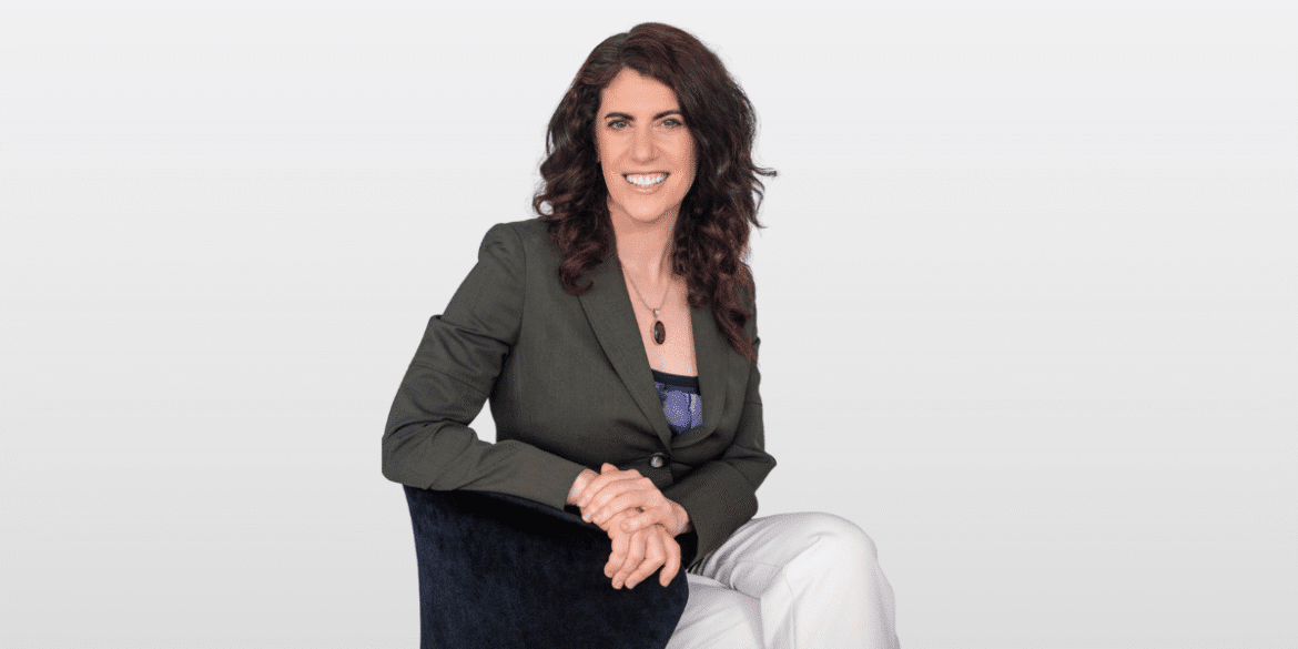 Robbie Spier Miller, founder of Hypnosis Training Canada, seated confidently, representing her role in transforming personal and professional growth.