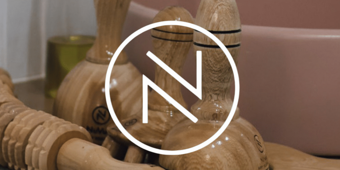 "NuVue Body Sculpting's logo with wooden lymphatic drainage tools, symbolizing their holistic approach to personalized wellness and lymphatic health."