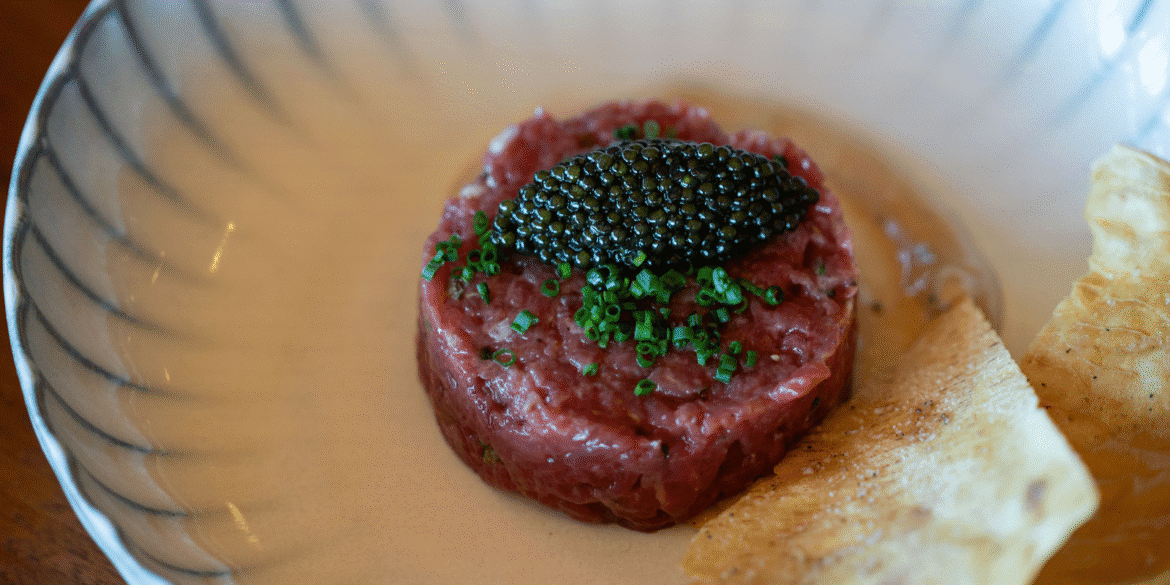 "Manzo Fassone beef tartare with caviar, showcasing the brand’s premium, raw, and delicately handled beef for luxury dining."