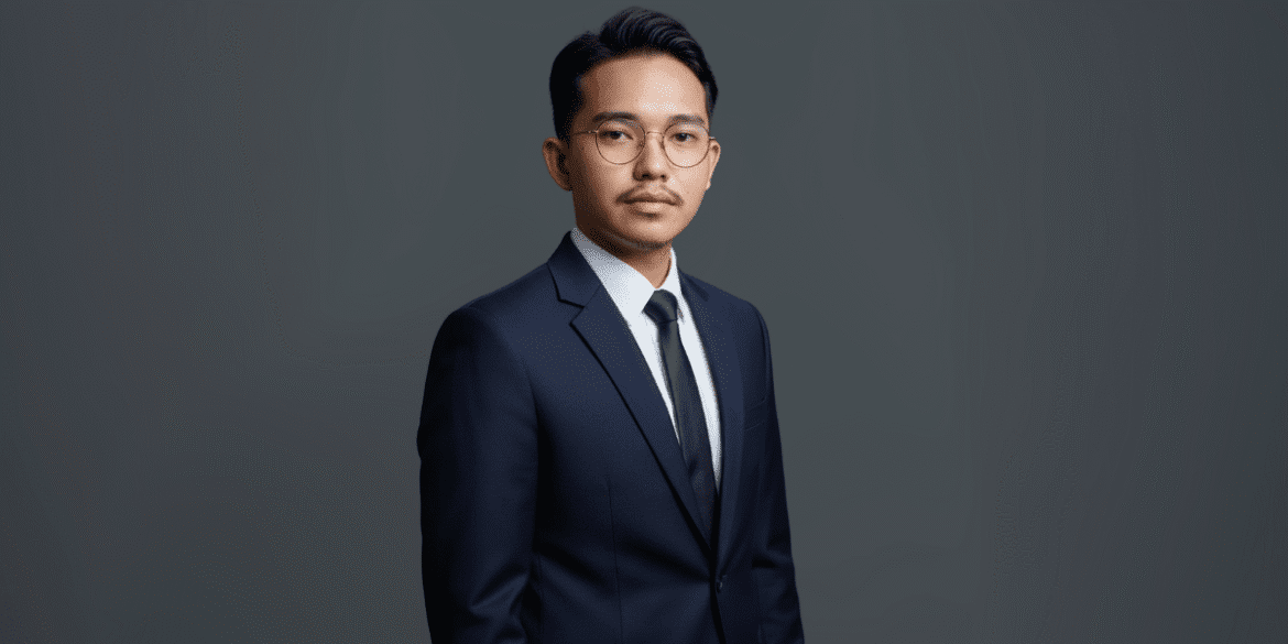 "Muamar Rafi Fadhilah, CEO of Artha Karya Group, exuding leadership in a professional suit, showcasing the group’s global business impact."
