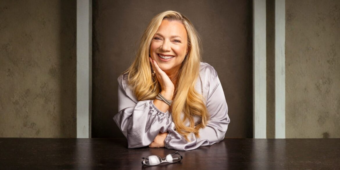 Clare Ford smiling confidently while seated, embodying empowerment and emotional intelligence for teens in her SwitchedON! program.