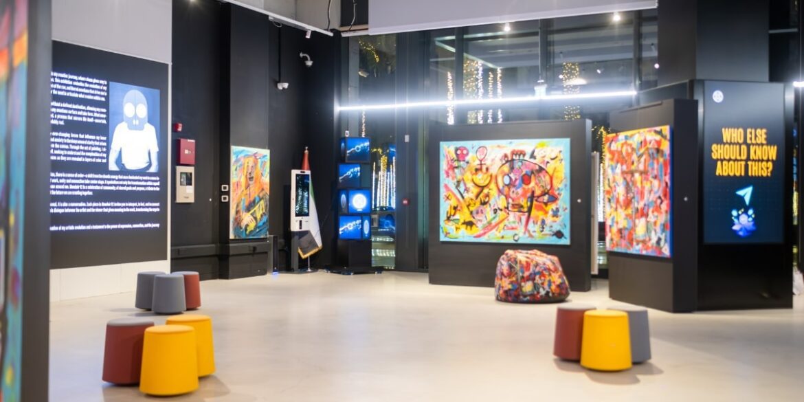 An art gallery space featuring vibrant artworks, digital displays, and modern seating, reflecting Mondoir's cultural vision and ethos.